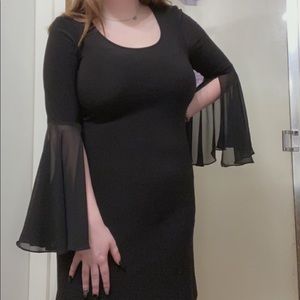 Black dress size small but fits like an large